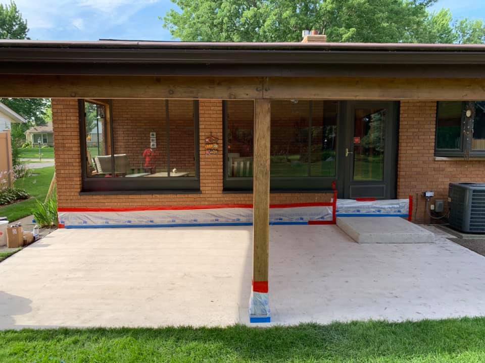 Bare concrete covered patio before Apex epoxy install