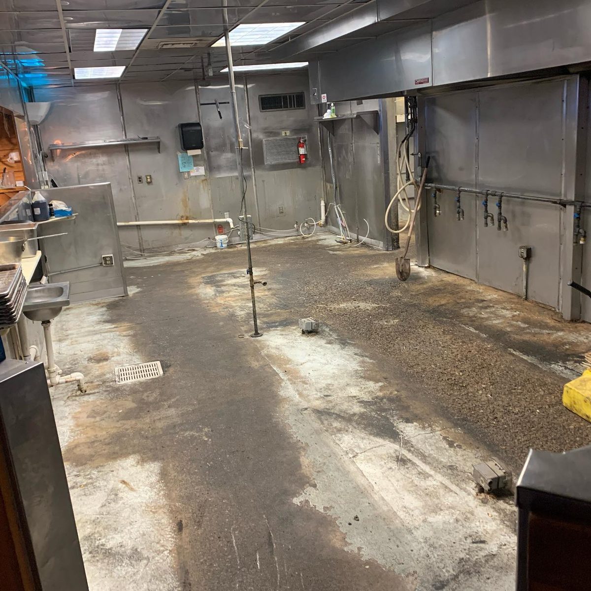 Bare concrete before Apex industrial epoxy install — Food & Beverage Plant