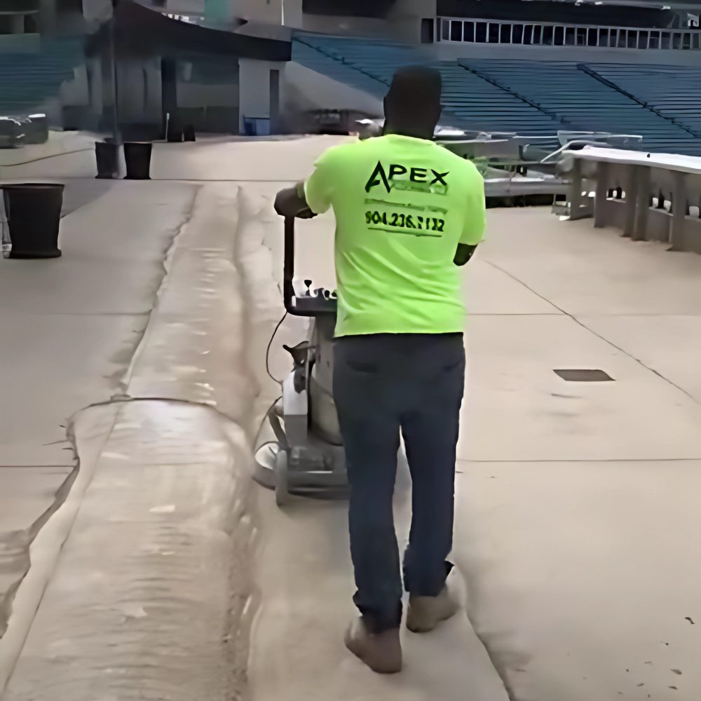 Bare concrete before Apex industrial epoxy install — Heavy Equipment Bay