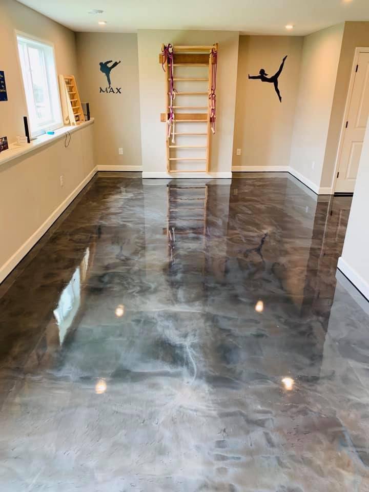 Dark metallic epoxy basement floor by Apex