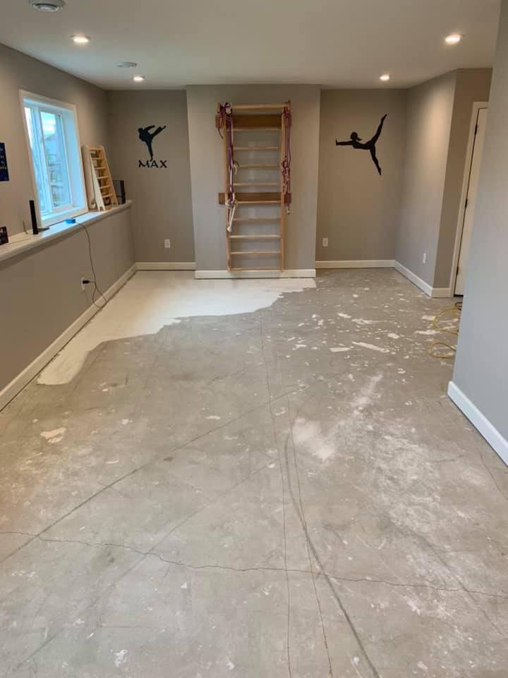 Bare basement concrete floor before Apex epoxy