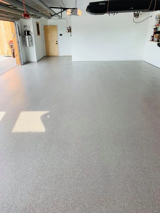 Finished gray flake epoxy garage floor after Apex install in Jacksonville, FL