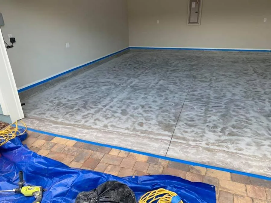 Prepped concrete slab with edge tape before Apex epoxy install in Charleston, SC
